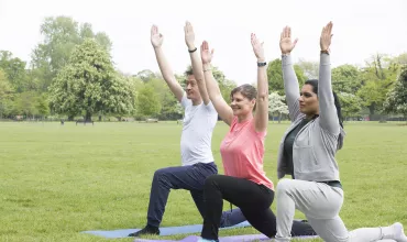 Group yoga in the park
